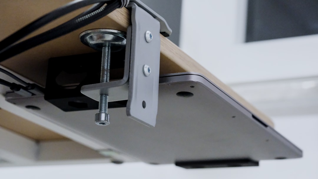 Clean home office desk setup with tidy cable management and a central docking station