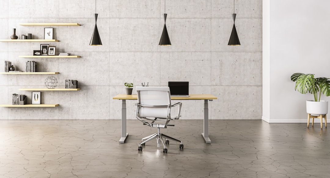 Modern home office workspace featuring dark wood slat acoustic wall panels mounted behind a desk.