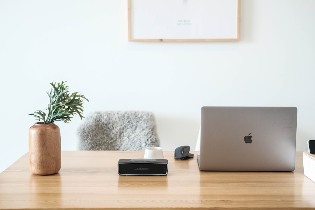 Clean home office desk setup with organized ethernet cables connecting to a modern router.