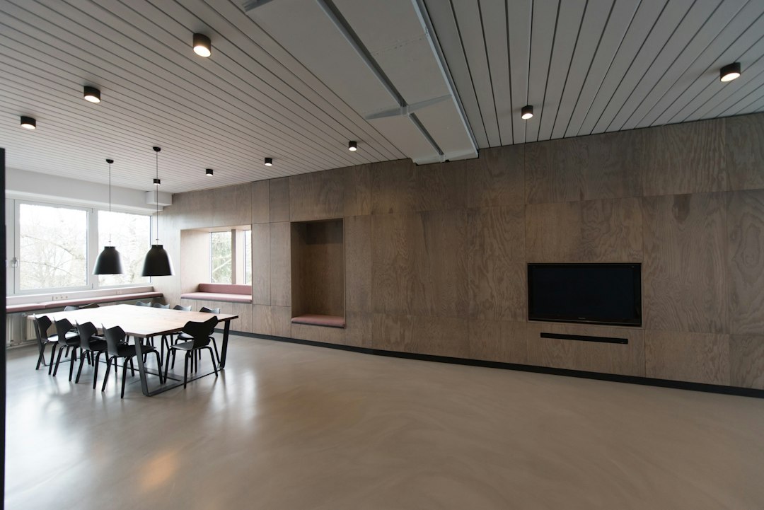 Acoustic felt wall panels mounted behind a modern home office desk